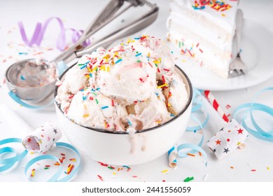 Birthday cake ice cream. Bowl portion of birthday cake taste white vanilla ice cream with colorful sugar sprinkles, funfetti with happy birthday decorations on table, copy space