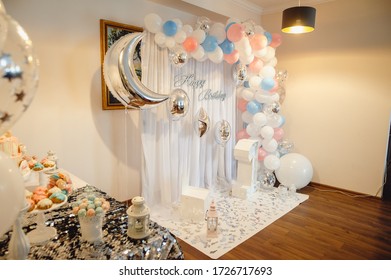 Birthday Cake on a background balloons party decor. Celebration concept. Candy bar. Table with sweets, candies, dessert. Celebrating a baby's birthday one year. Film noise