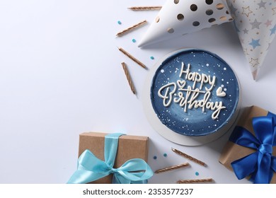 Birthday cake on colored background, top view