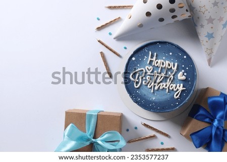 Birthday cake on colored background, top view