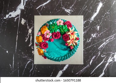 Birthday Cake Piping And Decorating To Create Amazing Blooming Succulents Rustic Floral Cake. Flat Lay Top Down View.