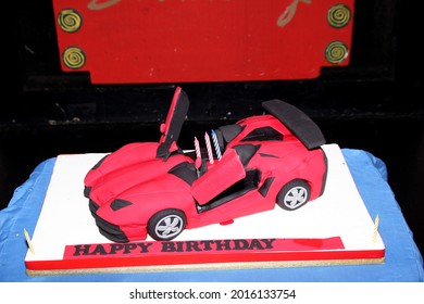 Birthday Cake In The Shape Of A Red Car. Jakarta March 16, 2016