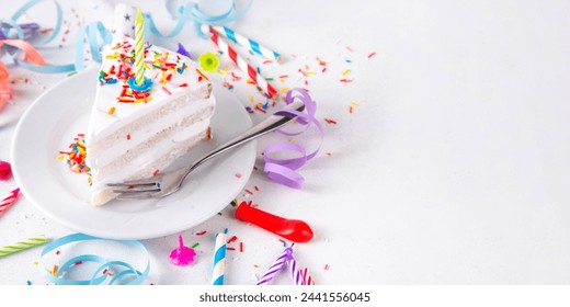 Birthday cake slice on birthday party decorated table.  Slice of Birthday Cake with white whipped cream, sugar sprinkles funfetti and candle, copy space - Powered by Shutterstock