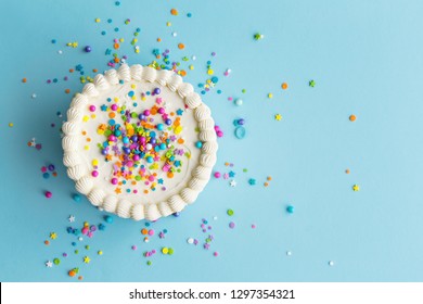 Birthday cake top view with colorful sprinkles - Shutterstock ID 1297354321