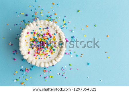 Birthday cake top view with colorful sprinkles