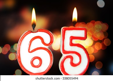 Birthday candles celebrating 65th birthday