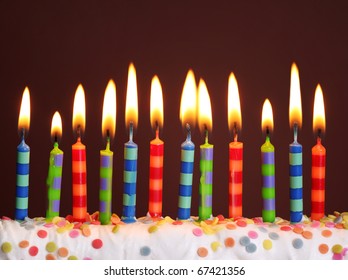 Birthday candles on brown background