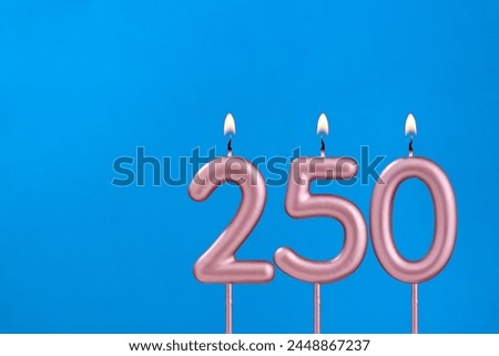 Birthday card with number 250 - Burning anniversary candle on blue background