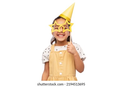 birthday, childhood and people concept - portrait of little girl in dress and party hat with glasses in shape of star over white background - Powered by Shutterstock