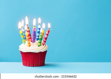 Birthday Cupcake Against A Blue Background