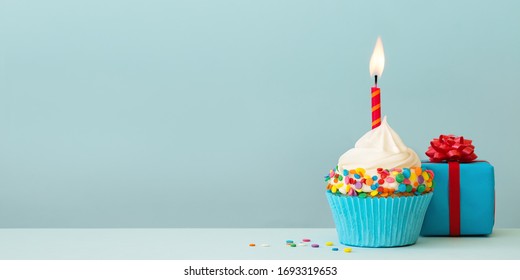 Birthday Cupcake With Candle And Gift Box