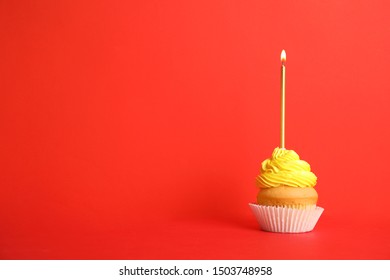 Birthday Cupcake With Candle On Red Background, Space For Text