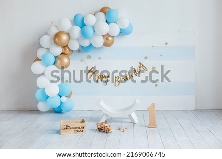 Birthday decorations with balloons. Festive room decoration in blue color with balloons. Room decoration for a birthday for a child. First birthday