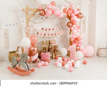 Birthday Decorations - Gifts, Toys, Balloons, Garland And Figure For Little Baby Party On A White Wall Background.