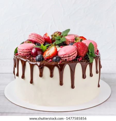 Birthday Drip Cake with chocolate ganache and fresh berries.