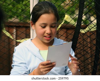 Birthday Girl Reading The Card