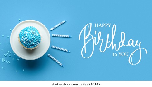 Birthday greeting banner with tasty cupcake on light blue background, top view