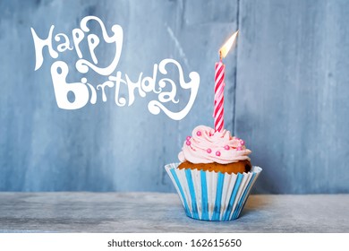 Birthday greeting card with cupcake and candle