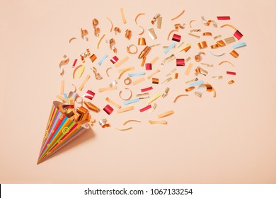 Birthday Hat With Confetti On Paper Background