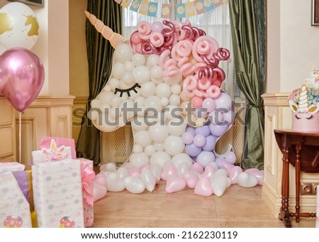 birthday holiday event for children with decoration in a unicorn from balloons and applications