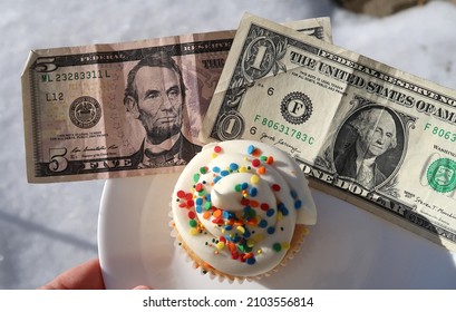 Birthday Money And Cupcake. President's Day Concept. Abraham Lincoln And George Washington Celebrating Their Birthdays In The Snow.