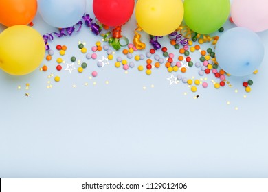 Birthday Party Background Border With Baloons And Confetti, On Blue Surface With Copy Space