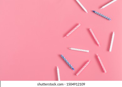 Birthday or party card composition. Pattern made of candle cake on pastel pink background.  Flat lay, top view, copy space