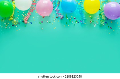 Birthday party decoration with balloons, steamers and confetti - Shutterstock ID 2109123050