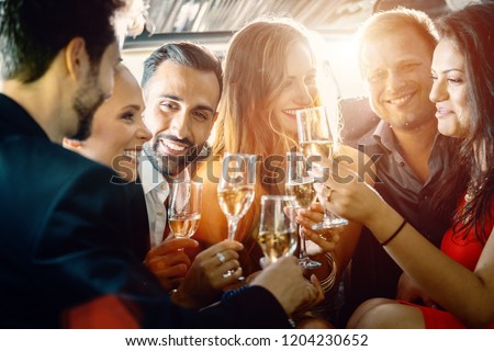 Birthday party in a limo with glasses of champagne 