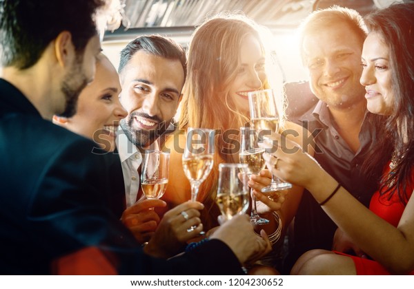 Birthday party\
in a limo with glasses of champagne\
