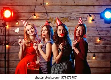 Birthday Party Teen Girlfriends. Young Girls In Hats And Props