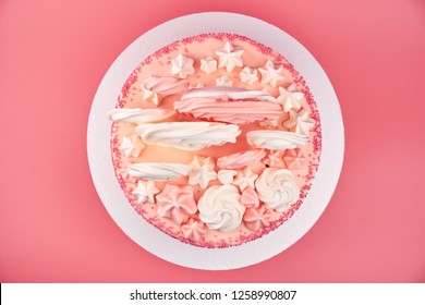 Birthday Pink Cake, Decorated With Meringue Cookies On A Pink Background. Top View.