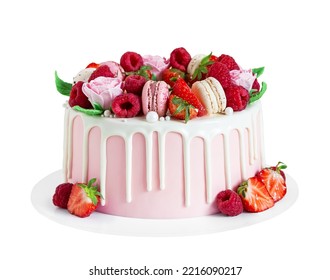 Birthday sweet cake with berries, macaron and floral decor isolated on a white background. Beautiful pink cake decorated with macarons, raspberries, strawberries and sugar rose flowers. 