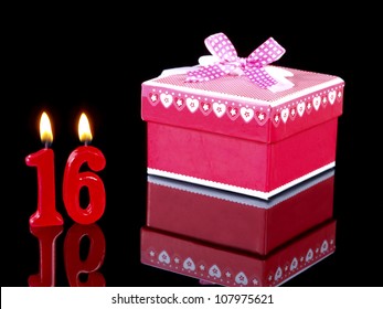 Birthday-anniversary gift with red candles showing Nr. 16