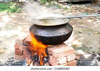 Biryani Cooking In A Village Party On A Temporary Brick Made Oven. Outdoor Cooking For Lots Of People In Large Aluminum Pan With Wooden Fire.