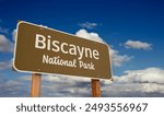 Biscayne National Park (Florida) Road Sign Against Blue Sky and Clouds.