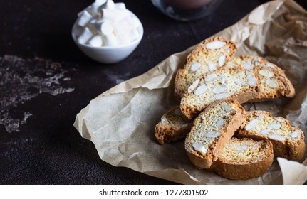 Biscotti or Cantuccini with almond and a glass cup of hot chocolate with marshmallows. Traditional Italian double baked cookies. - Powered by Shutterstock