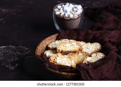 Biscotti or Cantuccini with almond and a glass cup of hot chocolate with marshmallows. Traditional Italian double baked cookies. - Powered by Shutterstock