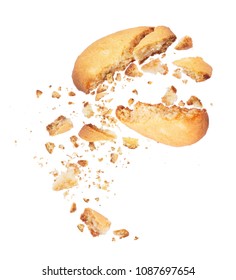 Biscuit Broken Into Two Halves With Falling Crumbs Down