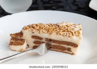Biscuit cake in a white plate in a restaurant