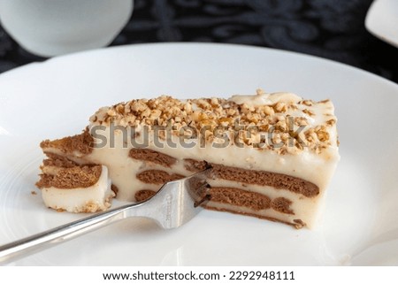 Biscuit cake in a white plate in a restaurant