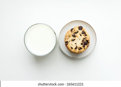 Biscuit Cookies With Chocolate Chips And A Glass Of Milk. Top View