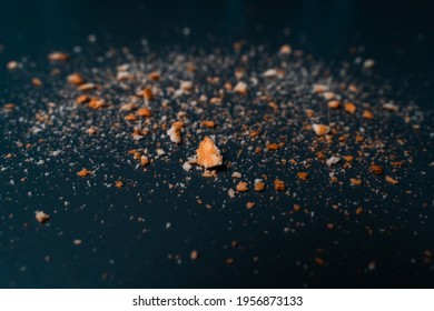 A Biscuit Crumbs In Dark Background