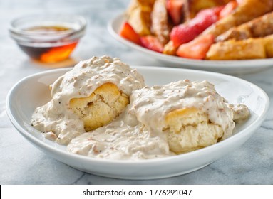 Biscuits And Gravy With Sausage On Plate