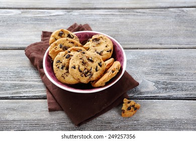 Biscuits in small bowl on rustic table, dessert