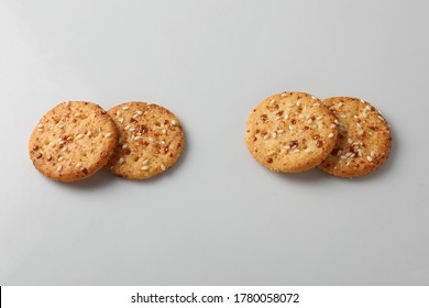 BISCUITS - A stack of delicious wheat round biscuits with a few crumbs isolated on white,sesame seeds buscuit,