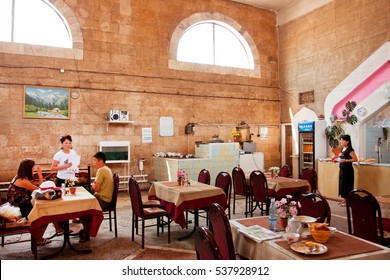 BISHKEK, KYRGYZSTAN - AUG 1: Interior Of Simple Cafe With Traditional Central Asian Food In Old Building On August 1, 2013. In Kyrgyzstan 34 Perc. Are Under Age Of 15 And 6.2 Perc. Are Over 65.