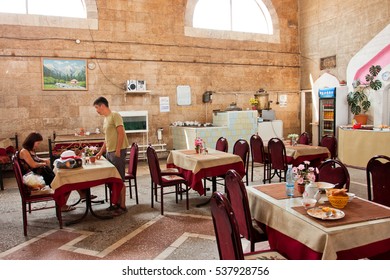 BISHKEK, KYRGYZSTAN - AUG 1: Young People Leave The Traditional Central Asian Cafe After Lunch On August 1, 2013 In Bishkek. In Kyrgyzstan 34 Perc. Are Under Age Of 15 And 6.2 Perc. Are Over 65.