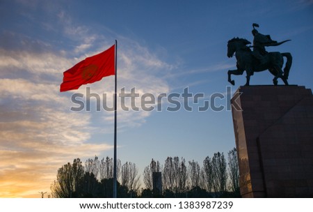 Bishkek, Kyrgyzstan: Monument for Manas, hero of ancient kyrgyz epos, together with national Kyrgyzstan flag on Bishkek central Ala-Too square 