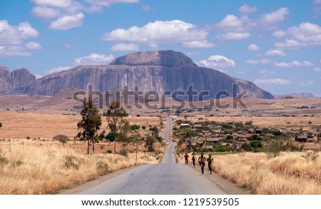 The bishop's hat mountain in Madagascar. This long road leads towards the mountain located in Madagascar's arid desert region south of the central highlands